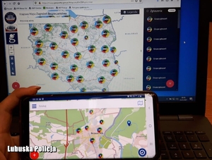Monitor komputera oraz telefonu z Krajową Mapą Zagrożeń Bezpieczeństwa